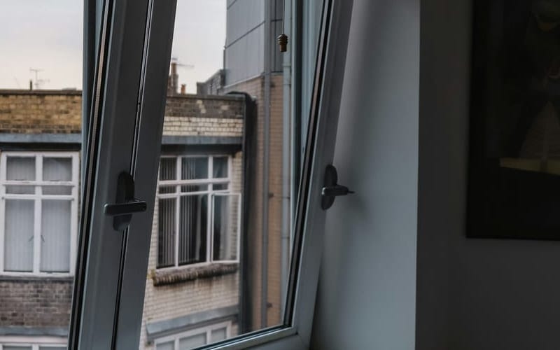 Handles of tilt-and-turn sashes on a PVC window in tilt position